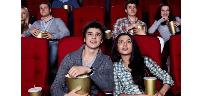 Cinema Young are closely watching a movie at the cinema e learning brothers